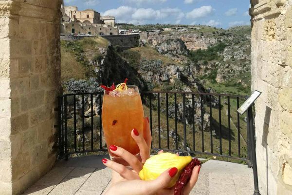 Cocktails held with Gravina di Murgia in background